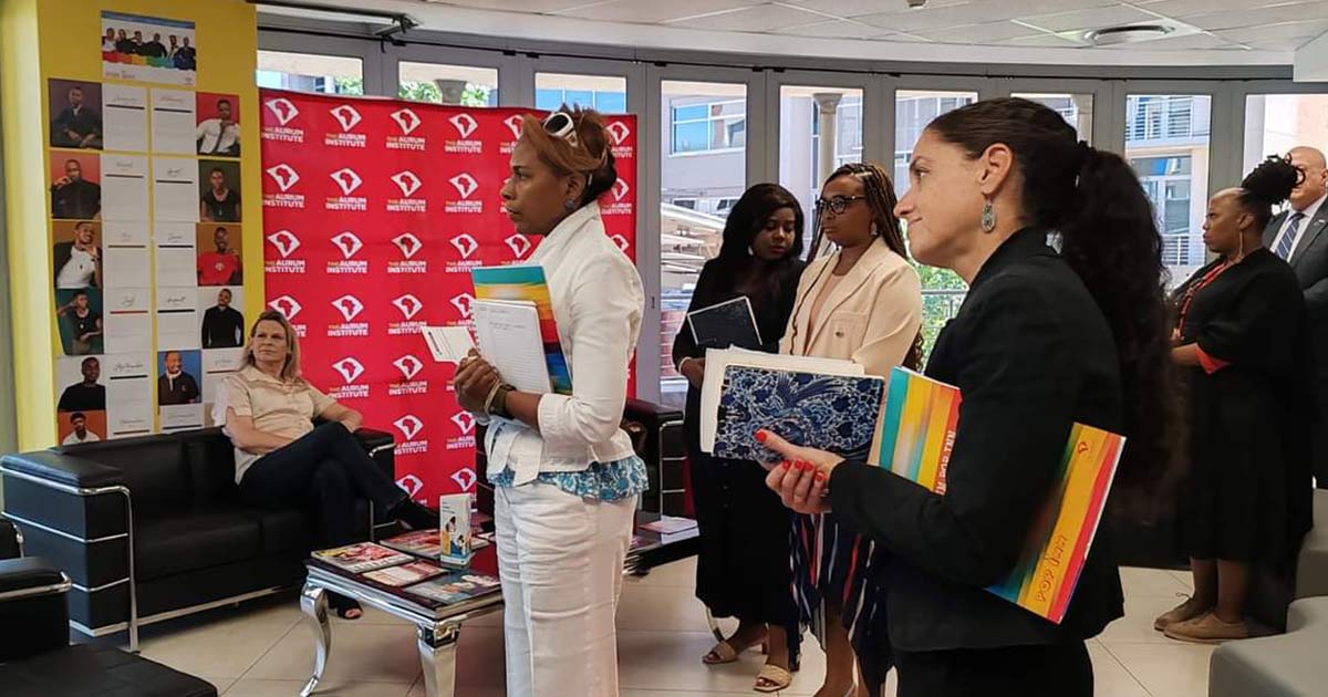 A photo of Heather Flynn, a Senior Professional Staff Member for Africa and Global Health on the US Senate Foreign Relations Committee, being briefed while visiting the Aurum POP INN clinic in Tshwane, South Africa